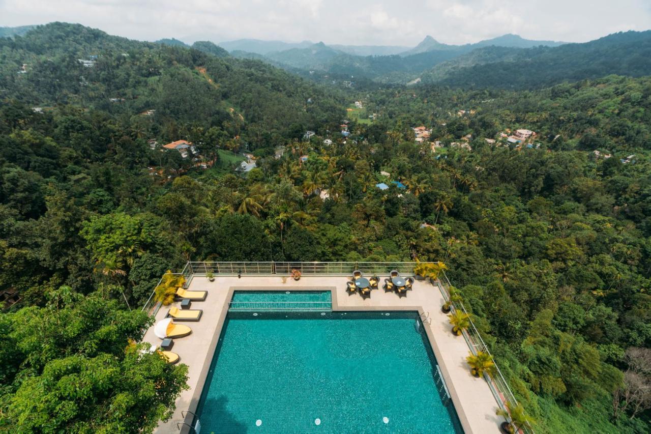 Готель The Panoramic Getaway Муннар Екстер'єр фото Aerial view of the swimming pool at the hotel